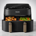 Moderne Philips Heißluftfritteuse mit zwei Kammern für Fleisch und Gemüse gleichzeitig ohne Fett zubereiten