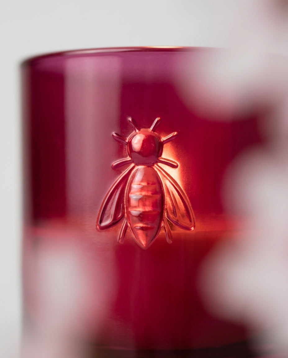 Scented candle in decorative glass — Embossed bee detail | Generated by Modelize