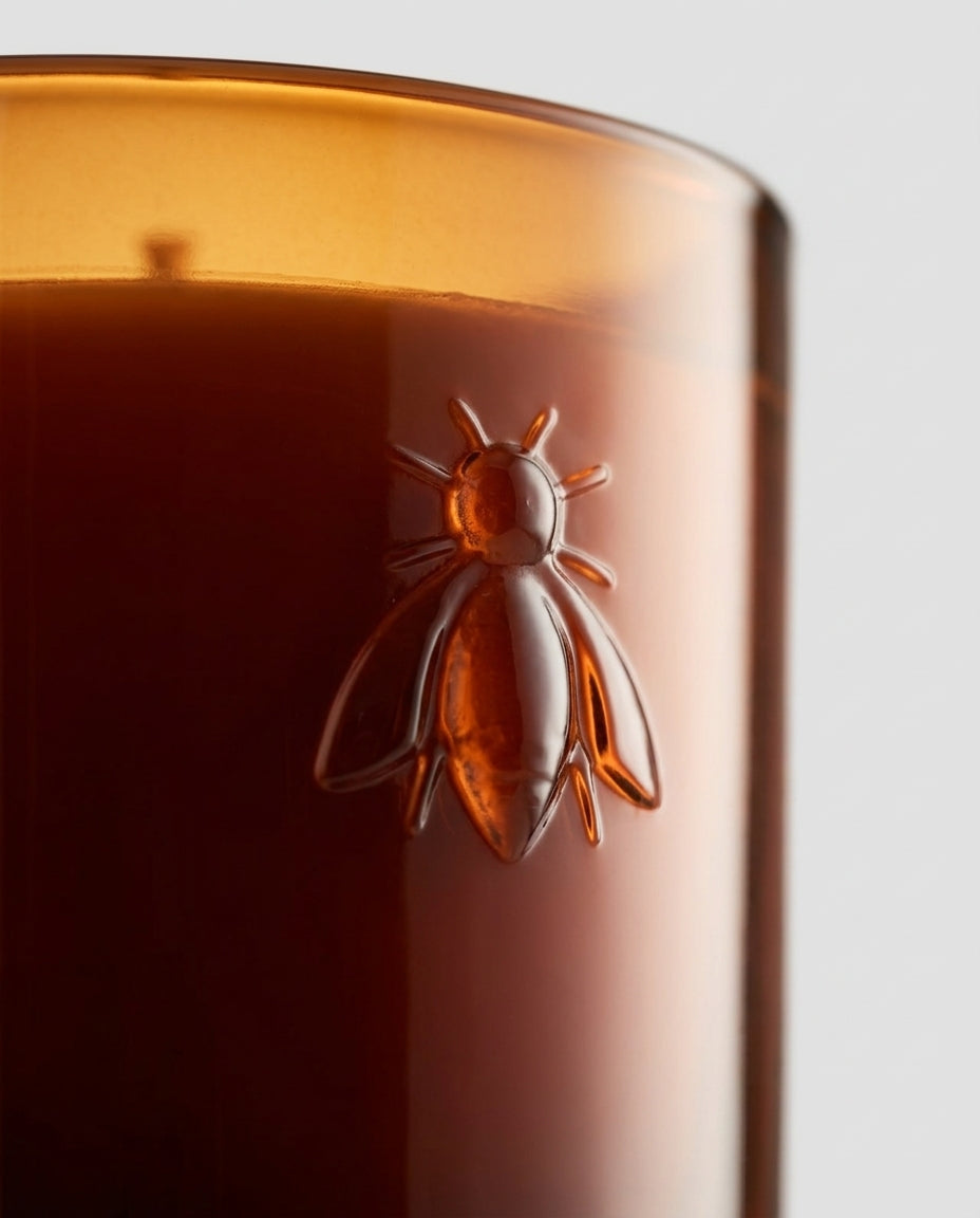 Scented candle in embossed glass — Embossed bee detail | Generated by Modelize